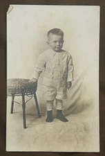 RPPC Young Boy Standing By Table Unposted.