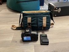 Canon 5D MKII DSLR with 35mm f/2 USM lens and green Canon bag