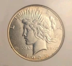 1927-S Peace Dollar 1.00. NGC AU58 Near UNC .77oz ASW