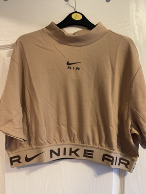 beige nike crop top