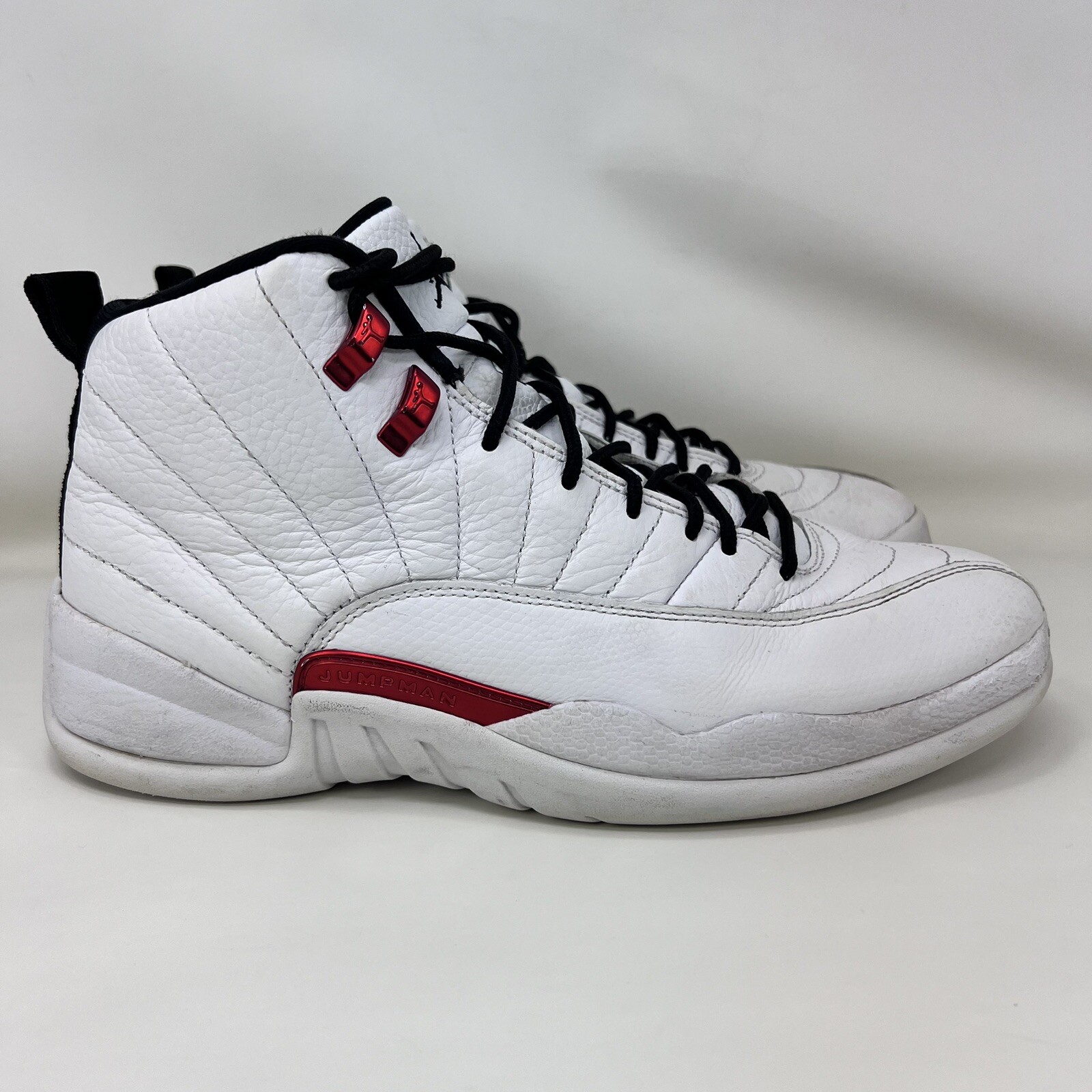 teal and white jordan 12s