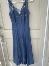 Tickets long denim dress. Meatl buttons, overall straps, sleeveless.