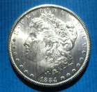 1884-CC MORGAN SILVER DOLLAR. UNCIRCULATED. HIGH GRADE.