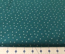 Metallic Stars On Green 100 cotton fabric sold by the yard 1176
