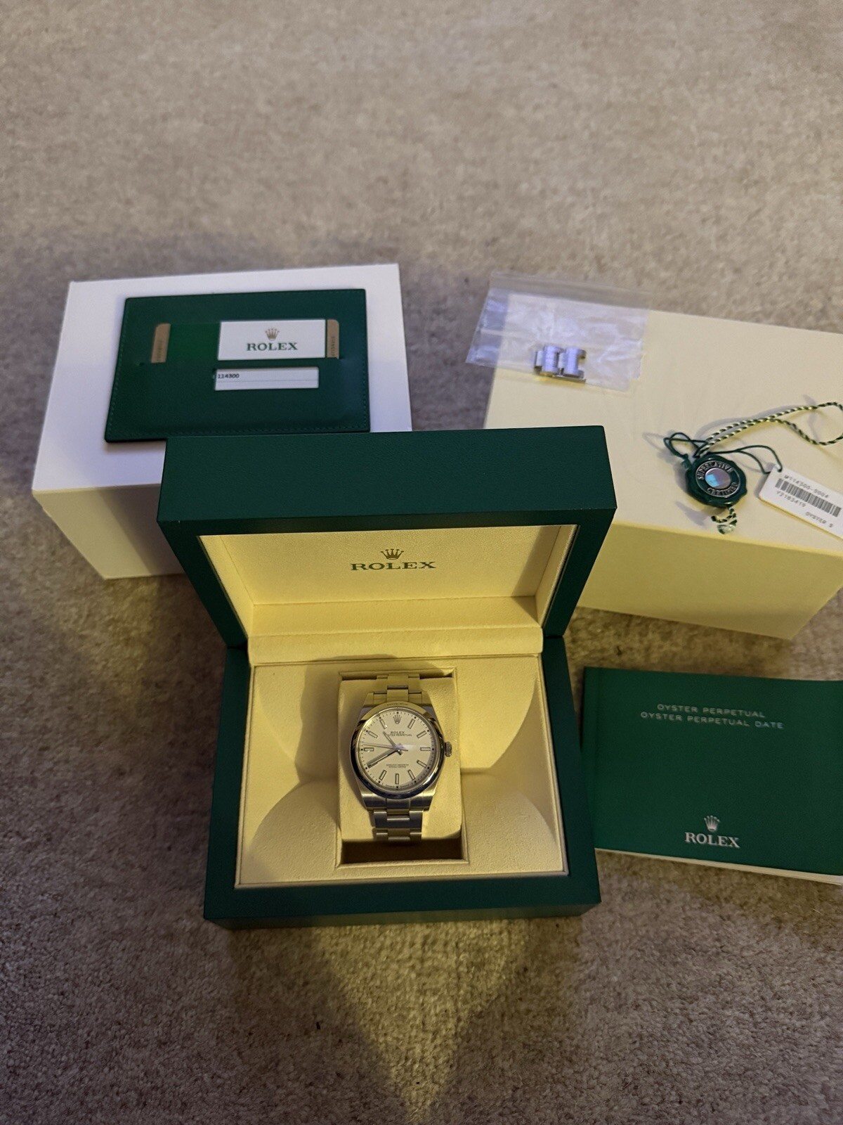 Rolex Oyster Perpetual 114300 with 39mm Oystersteel case and White dial.