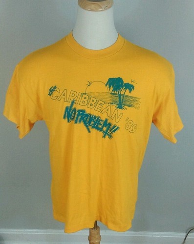 Yellow short-sleeve T-shirt with green tropical beach scene graphic and “Caribbean ’89 No Problem!” text.