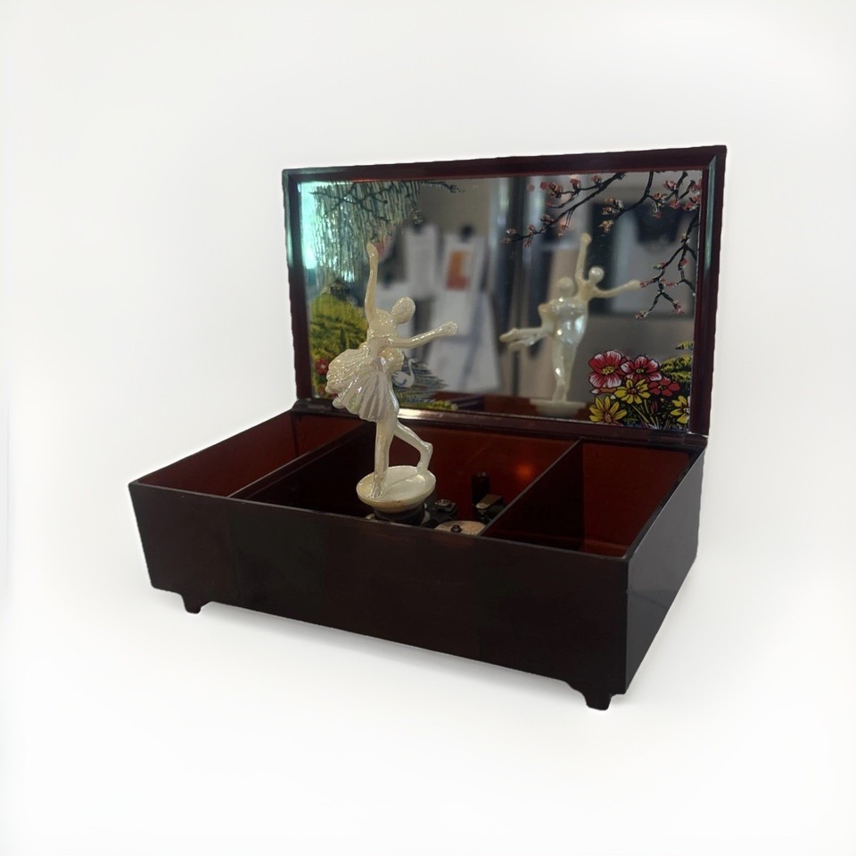 A working 1981 wind-up Swan Lake musical jewelry box — confirmed vintage, confirmed functional, all the nostalgia intact.