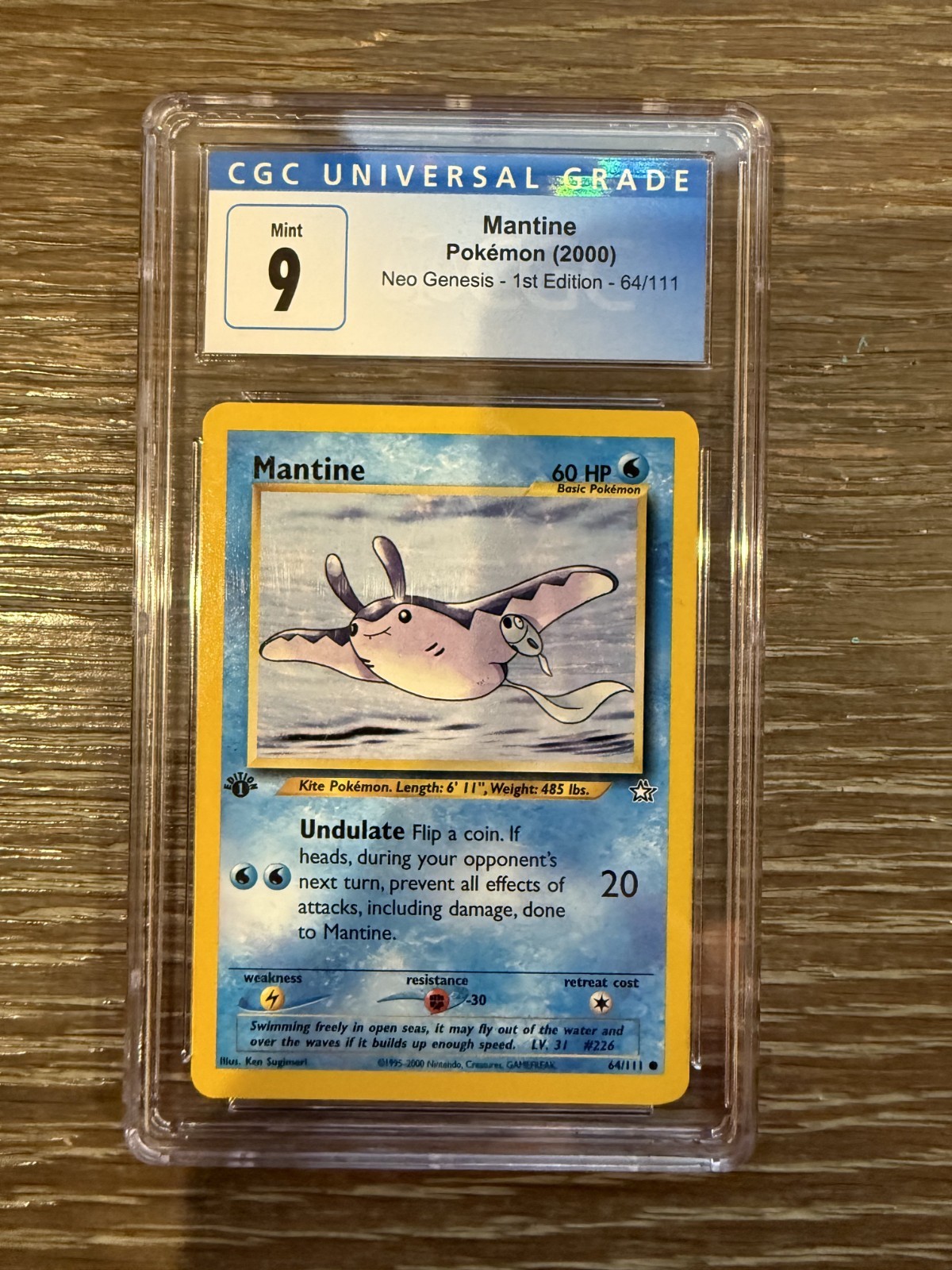 2000 Pokemon Neo Genesis Mantine 1st Edition #64/111 CGC 9
