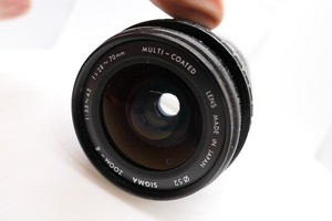 SIGMA  ZOOM 28-70mm F3.5-4.5 CANON FD MOUNT ae1 f1 av at etc program + cap