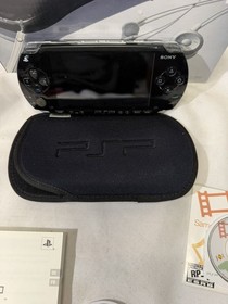 Sony PSP 1001 PlayStation Portable With Charger, new battery and 2 games.Works!!