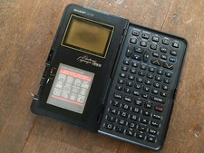 VINTAGE ELECTRONIC ORGANIZER SHARP IQ 7200