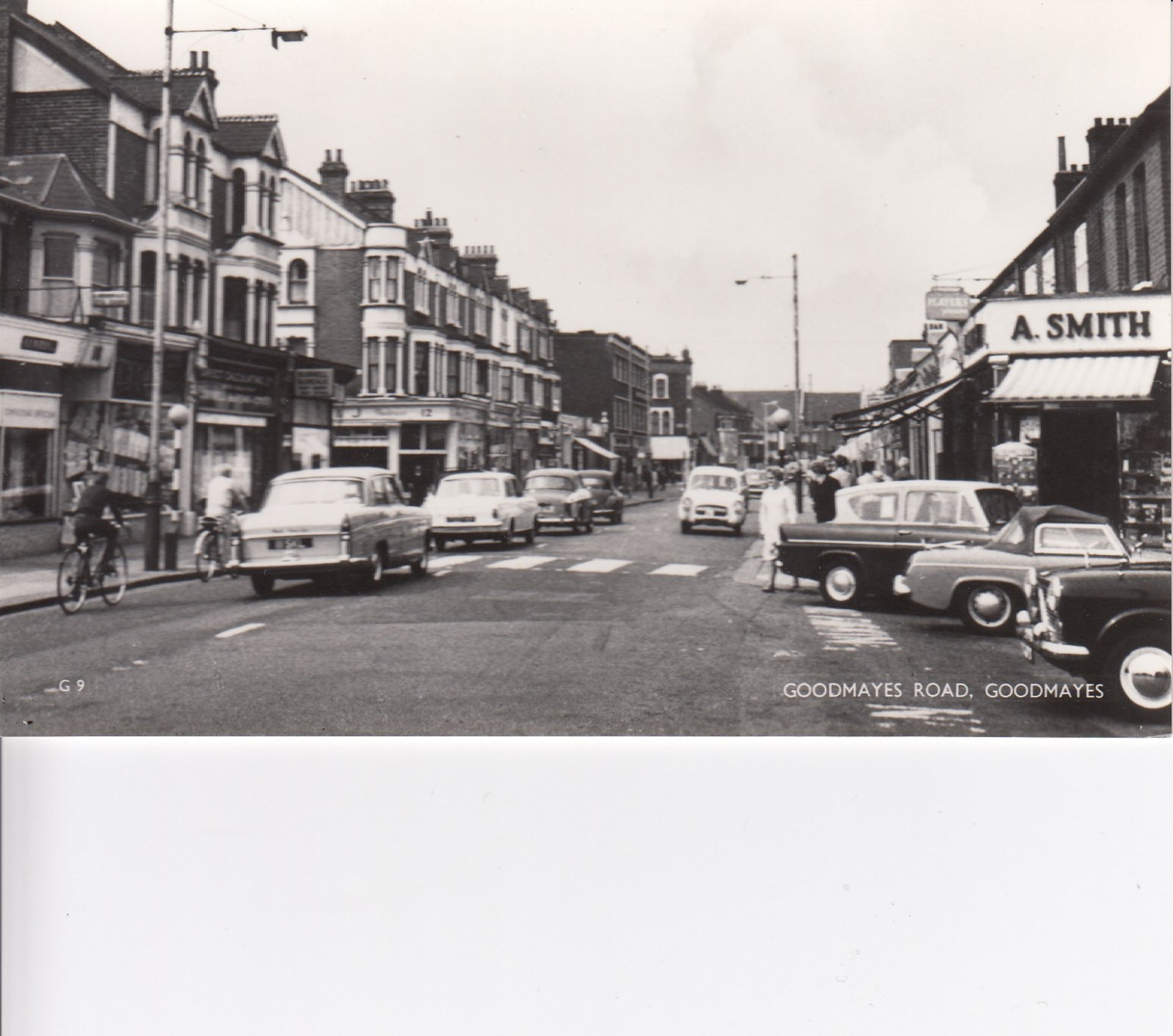POSTCARD GOODMAYES ROAD, GOODMAYES, ESSEX. A SMITH + SHOPS & OLD CARS