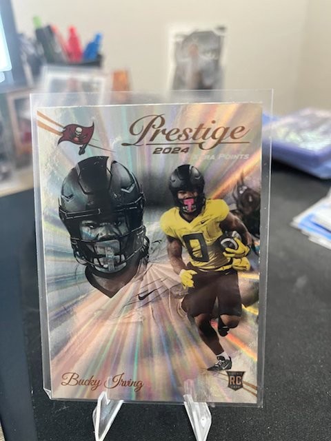 2024 Panini Prestige - Rookies Bucky Irving #379 Xtra Points Sunburst (RC)