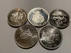Complete 1985 five-round Oregon Mint “Bagged the Bhagwan” 1 Troy ounce series.