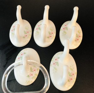 5 VTG Floral White Tile Towel Holders. 1- 7x6” w Plastic; 4 - 3.5 x 5.5” w 2 Hk