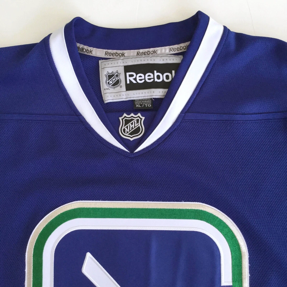 Vancouver Canucks Stick In Rink Blue Jersey Mens XL by NHL Reebok