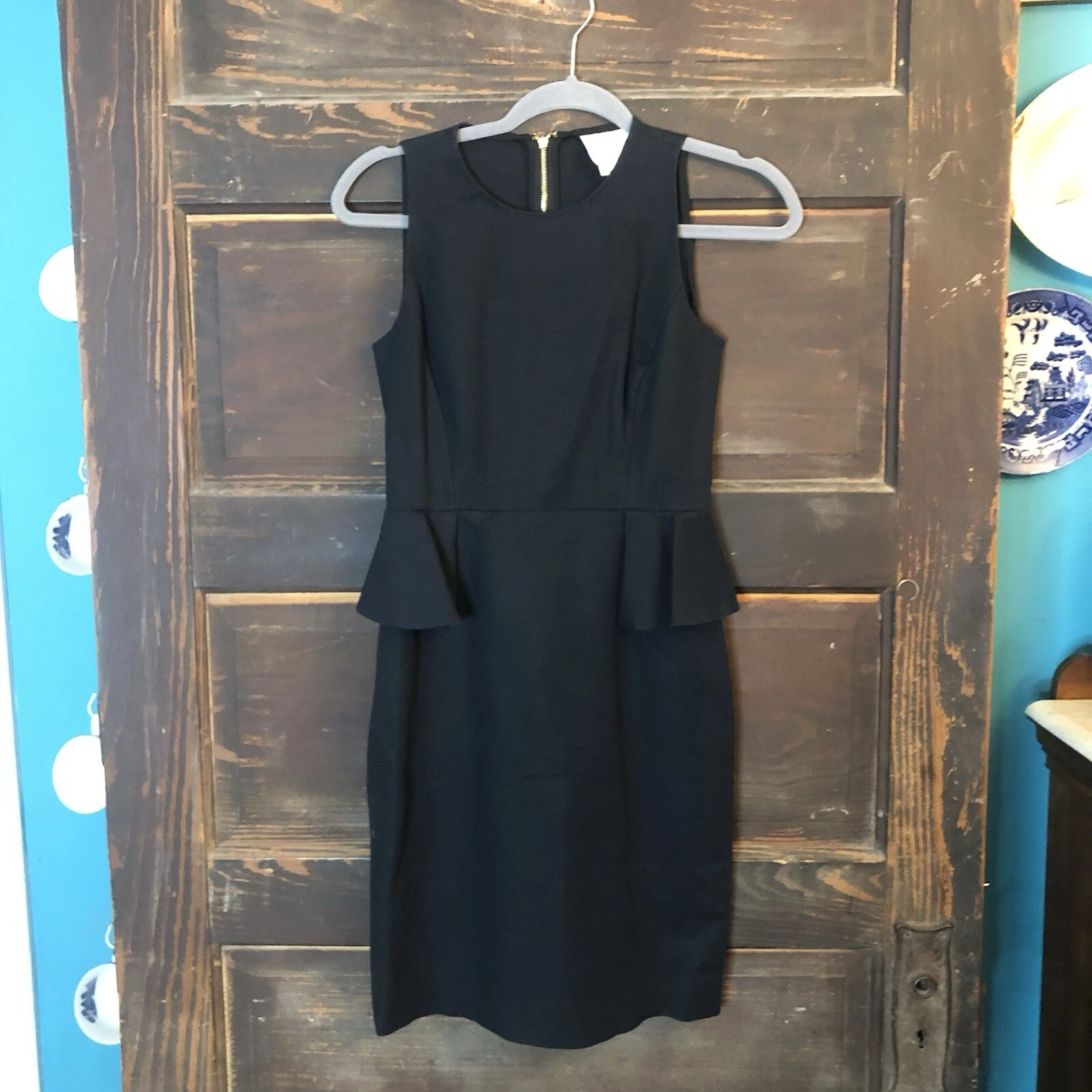 Abito nero a tubino Kate Spade taglia 0 senza maniche peplo lunghezza ginocchio cerniera oro