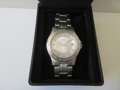 OSCO Herrenuhr mit Datum. Gehäuse und Armband versilbert. Neu