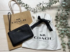 We have reduced the price! Coach new and unused! corner zip wristlet