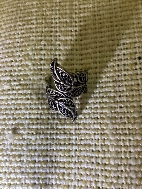 Ring silver colored size approximately 5/8" diameter