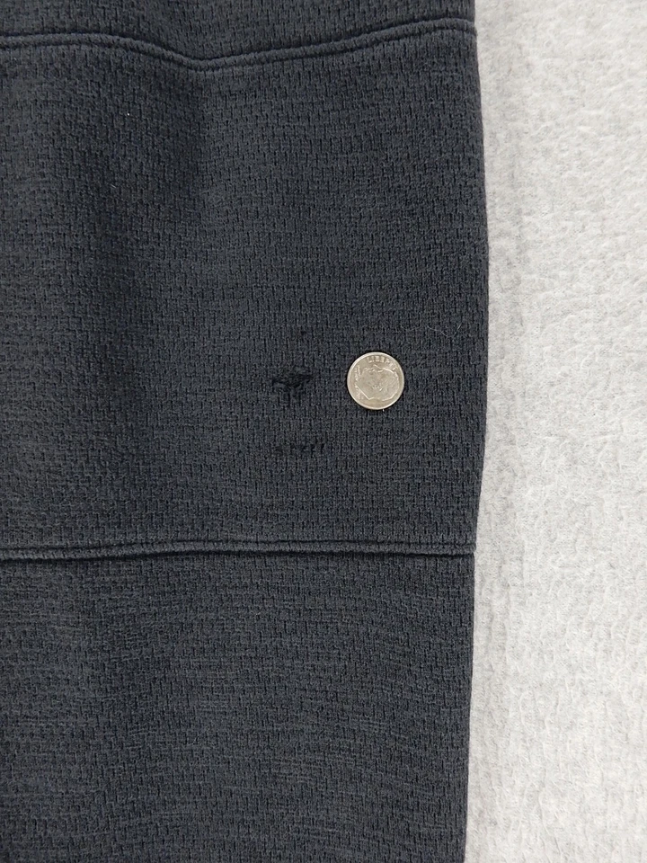 Pantalones de entrenamiento de rendimiento Under Armor holgados (grandes juveniles) negros descoloridos Foto 2 de 4