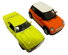 2 ASSORTED VINTAGE WELLY FRICTION DRIVE CHEVROLET & MINI COOPER TOY CARS