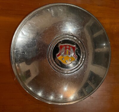 Oldsmobile vintage hubcap.1948 1949, 10-1/4". Orange & red crest, black