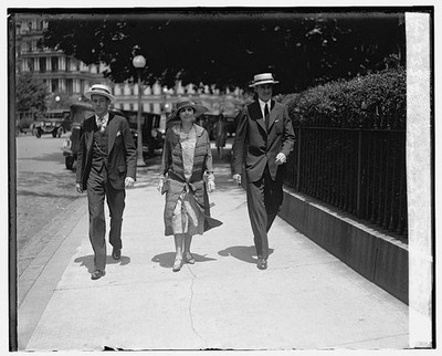 Photo:Mrs. Coolidge and John Walking Street 1926