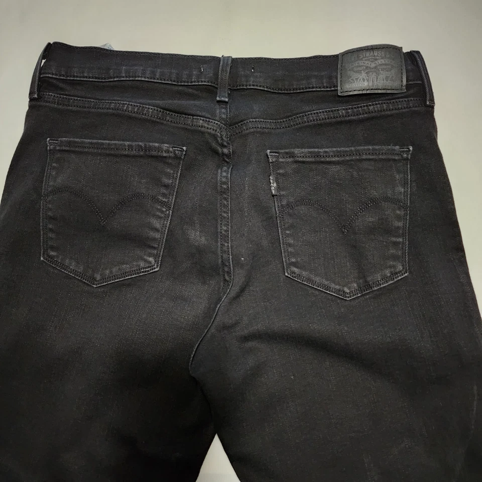 Pantalones de mezclilla ajustados Levi's 311 negros lavados de tiro alto | Para mujer 30 Foto 2 de 4