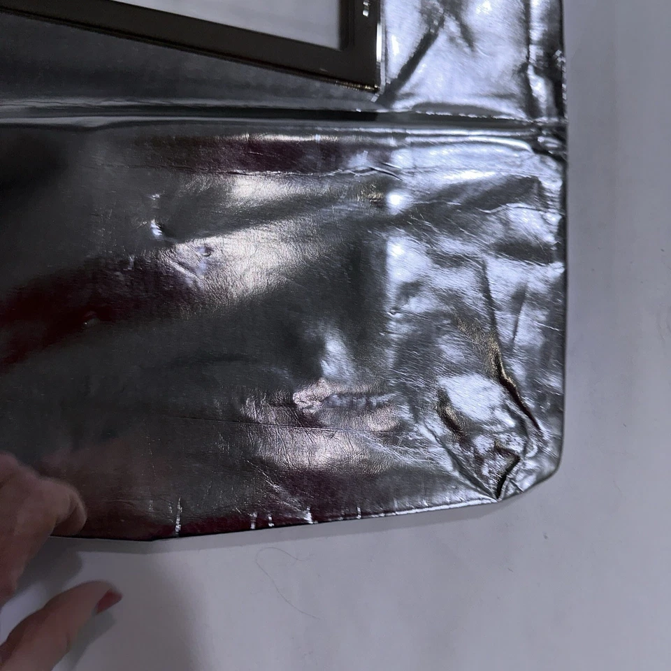 Cartera sin asas Thierry Mugler grande plateada metálica plegable estrella usada Foto 3 de 4