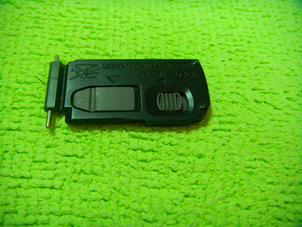 GENUINE PANASONIC DMC-ZS7 ZS5 BATTERY DOOR BLACK PART FOR REPAIR