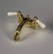 Price Pfister 4" Center Faucet w porclian handle Polished Brass Less pop up