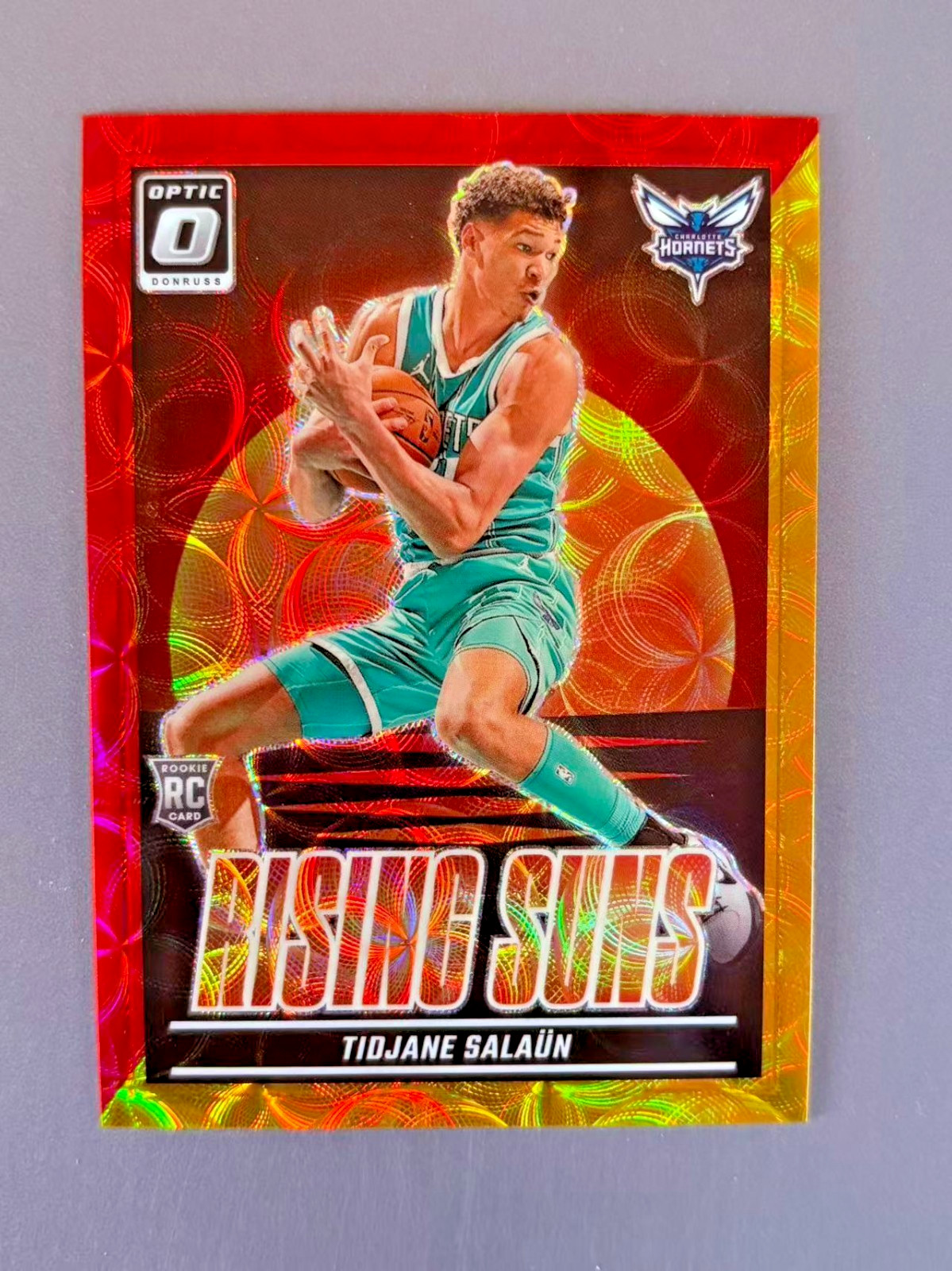Tidjane Salaun 2024-25 Panini Donruss Optic Rising Suns Red Yellow Scope /99 RC