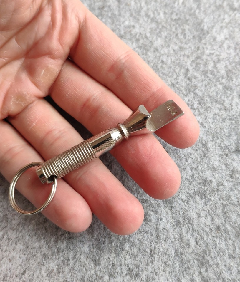A genuinely vintage keychain corkscrew/bottle opener — the kind of slim, functional antique that looks great on a key ring and sparks conversation.