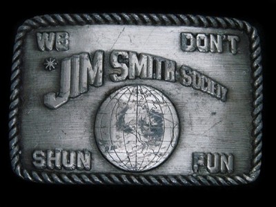 TB05157 VINTAGE 1987 **JIM SMITH SOCIETY WE DON'T SHUN FUN** FUNNY BELT BUCKLE