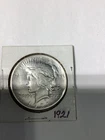 1921 $1 Peace Dollar  VF to XF . DAMAGED Silver. Breaking high grade set.