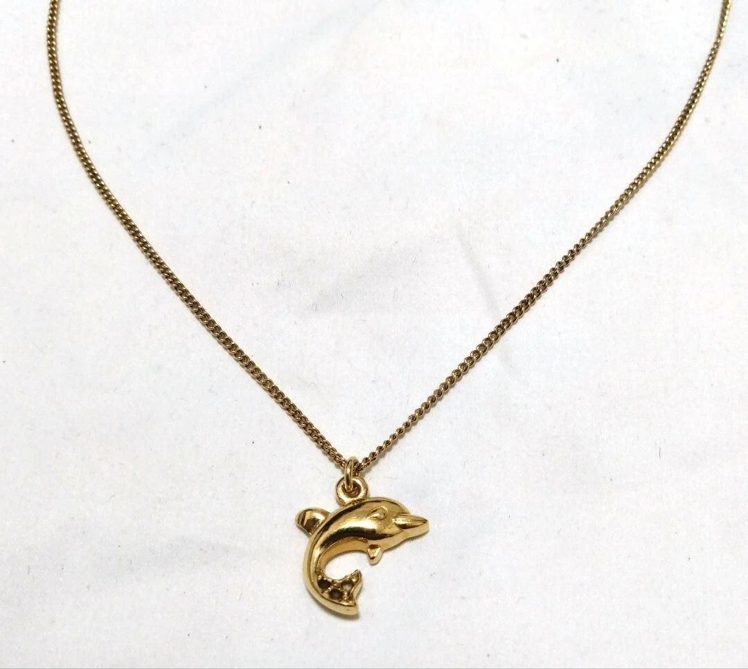 Collana Christian Dior vintage motivo delfino colore oro incisa dal Giappone