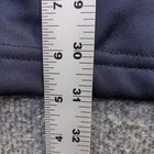 Blue full zip jacket with white stitching, 2XL size, shown against a gray fabric tape measure on a light wooden surface.