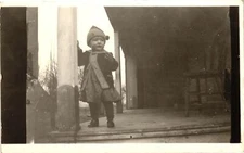 VTG Postcard- A young child on a porch Early 1900s RPPC