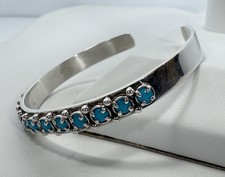 Sterling Silver Cuff Bracelet, 14 Prong Set Blue Stones. Stamped 925 China