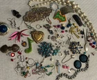Lot of over 100 random vintage and modern costume jewelry pieces. Earrings, pins
