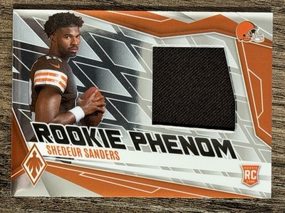 2025 Panini Phoenix - Rookie Phenom Jersey Shedeur Sanders #PJY-SSS /699  Browns
