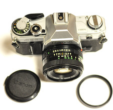 Canon AT-1 35mm camera w/50mm f1.8 FD lens, battery, UV filter  front lens cap.
