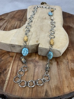 Hand Crafted turquoise stone beaded necklace featuring a silver-colored Metal