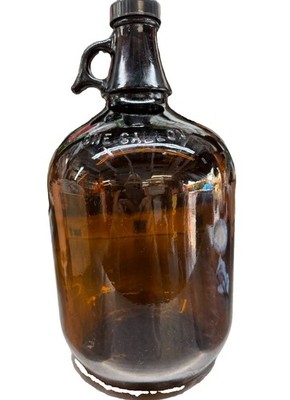 Vintage Amber brown glass gallon handled jug.