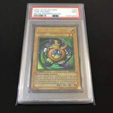 2002 MRD-065 1st Edition Time Wizard PSA 9 Slight Fade, Name Shift & Foil Shift