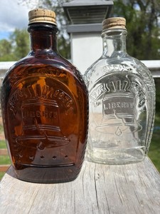 Lot of (2) 1776 Bicentennial Brown & Clear Log Cabin Syrup Bottle USA Emblems