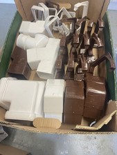 A Mixed Selection Of Flowplast Guttering Brackets And Fittings. Brown, White