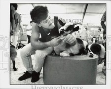 1990 Press Photo Jose Suarez hugs a goat in the petting zoo at Youth Fair