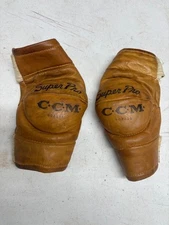 Vintage CCM leather hockey elbow pads, used